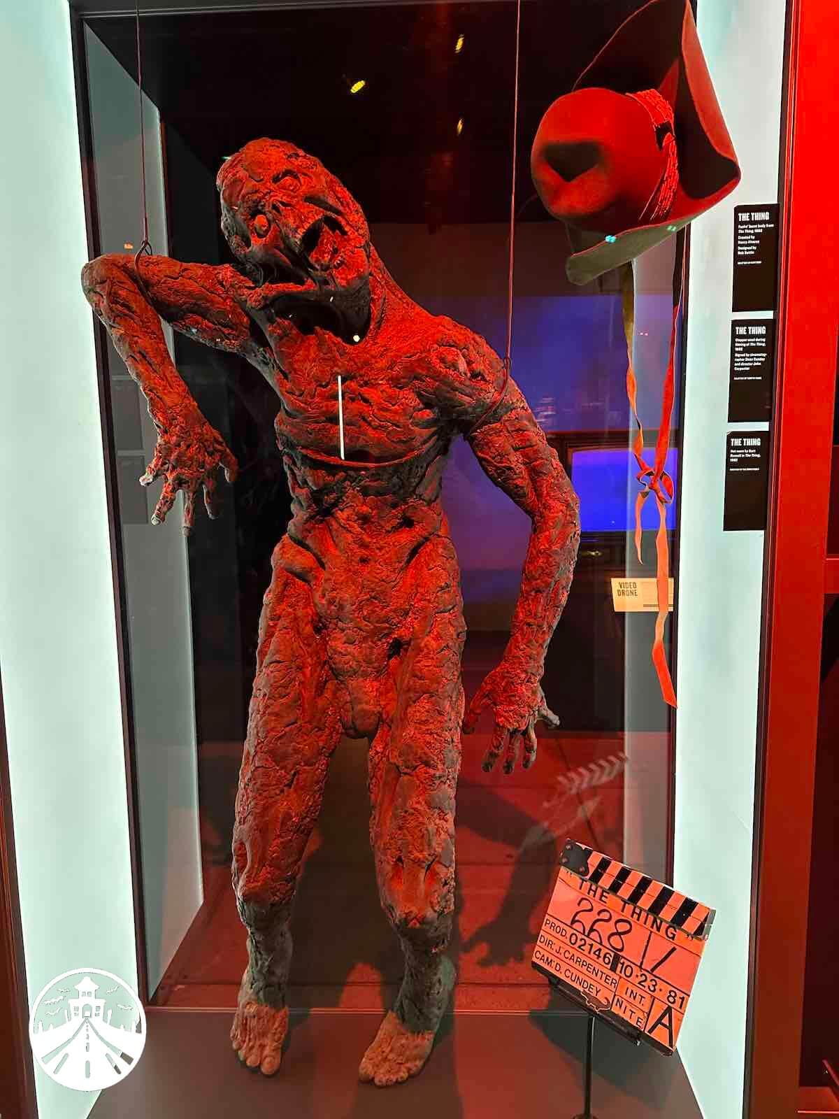 The Thing-fuchs The Thing (1982) - Fuchs' burned body, designed by Rob Bottin, created by Henry Alvare, MacReady's hat worn by Kurt Russell, signed clapperboard