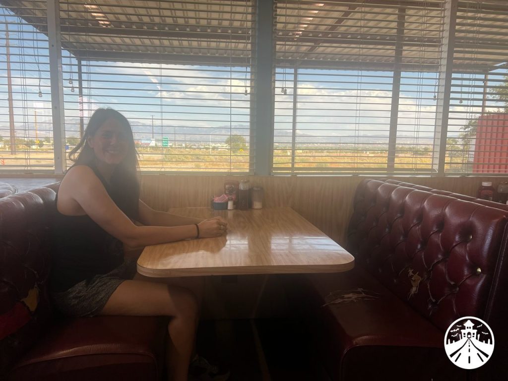 Gem really dorking it up in the same seat K-Stew sat in at Cafe 66.