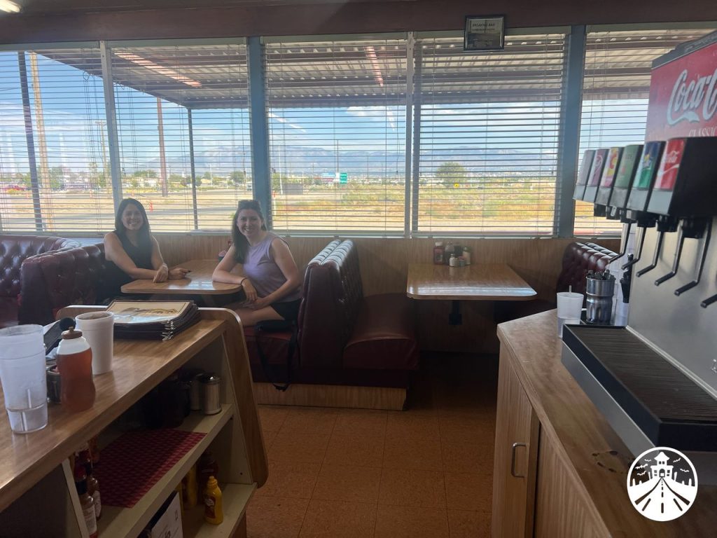 Gem and Glenna in the booth, having a much better time than Lou in Love Lies Bleeding.