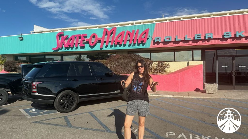 Gem standing outside Skate-O-Mania, the filming location for Rink-O-Mania in Stranger Things Season 4.