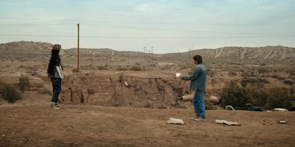 Jonathan and Argyle playing golf at a desert park in Stranger Things Season 4.