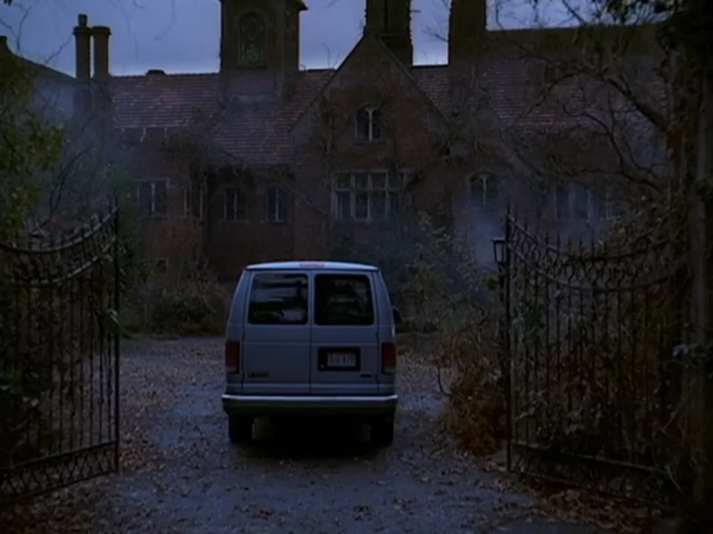 A van carrying the main group pulls up outside the Rose Red gates at Spring Street and 7th Avenue in Seattle.